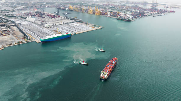 istock aerial view cargo container ship sailing in sea to import export goods transportation and commercial port background 1475304312