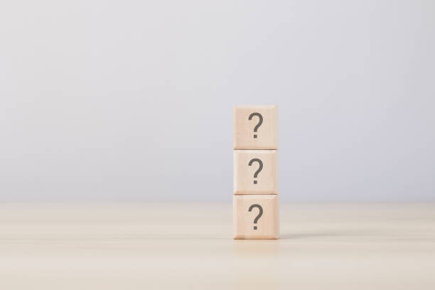 istock vertical wooden blocks in white background question mark concept 1475304874