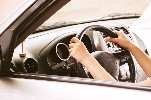 istock young woman in car 147530635