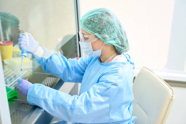 istock Woman scientist works in a testing unit in modern laboratory 1475306354