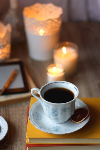 istock Books, Glasses, E-Reader, Pen, Tea, Cookies and Candles 1475309313