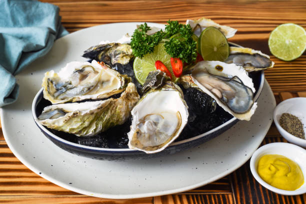 istock Raw oysters in creamy served with sauces close up 1475311608