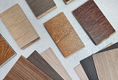 top view variety of wood texture for furniture and flooring furnishing material samples. interior material design samples. laminated, veneer, engineering wood flooring, wooden vinyl tile samples.