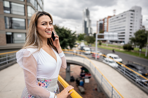 Portrait of a mature woman talking on mobile phone in the city