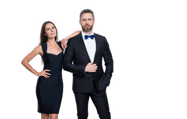 formalwear couple in studio, copy space. formalwear couple on background. formalwear couple in studio, copy space. formalwear couple on background. photo of formalwear couple wear tuxedo. formalwear couple isolated on white. well dressed stock pictures, royalty-free photos & images