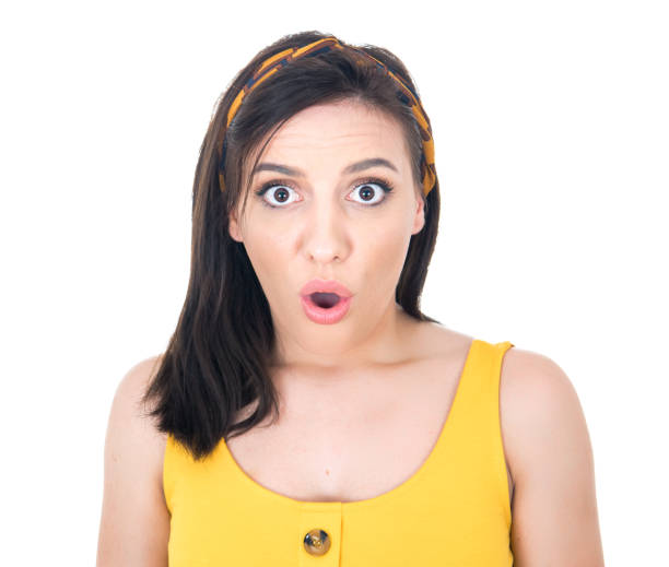 Surprised face of woman stare to camera, isolated on white background. Surprise expression face - head and shoulders of a amazed girl. Wao - omg concept stock photo