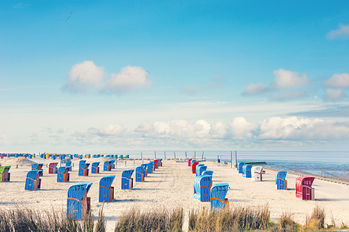 Beach chairs on the North Sea at Spring, Nessmersiel, East Frisia, Lower Saxony, Germany 2023