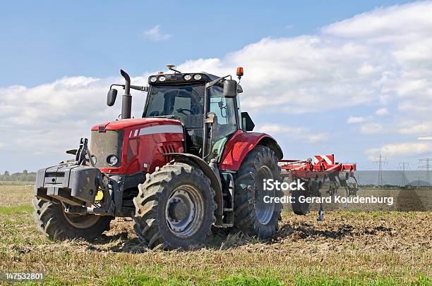 Tractor In Plowed Field Stock Photo - Download Image Now - Agricultural Field, Agricultural Machinery, Agriculture