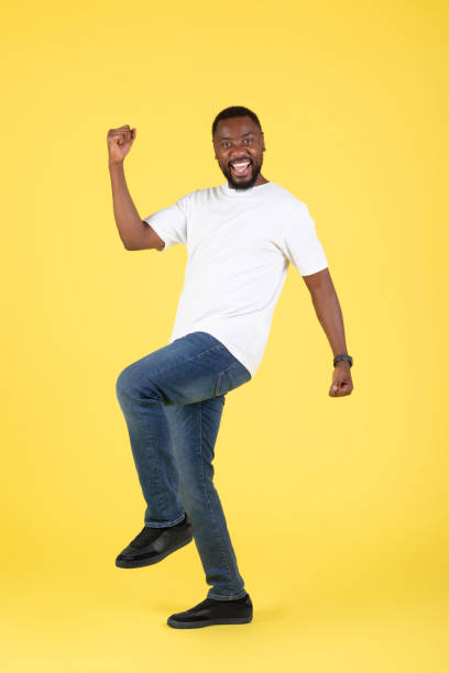 istock Joyful Black Man Gesturing Yes Standing Over Yellow Background, Vertical 1475329040