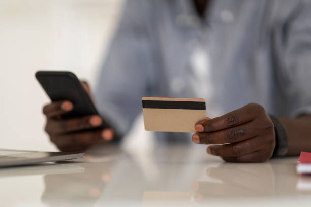 istock E-Commerce Concept. Unrecognizable African American Man Using Smartphone And Credit Card 1475329179