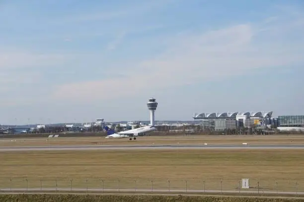 Photo of The airport in Munich. The plane is landing. The plane takes off. Runway at Munich airport, Germany.