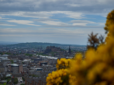 View over Edinburgh, the capital of Scotland, from the top of Arthurs seat, the iconic hill close to the city.