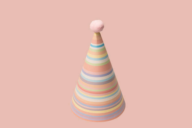 Bright and colorful birthday cap isolated on a peach background. Holidays cocept.