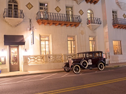 Saint Augustine, FL - USA, February 28, 2023. Casa Monica resort and spa hotel in downtown Saint Augustine with vintage model T Ford parked out front.