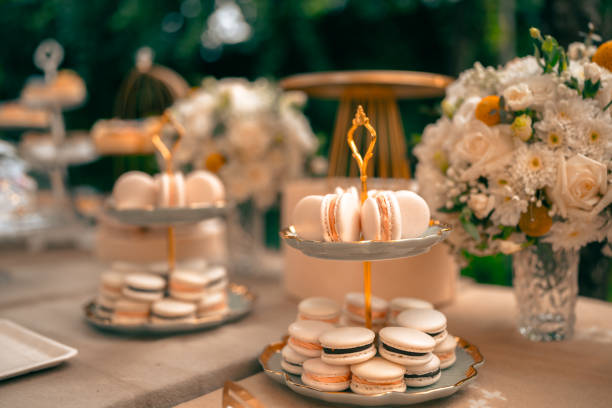 Tea party At The Garden, Beautiful English Afternoon Breakfast Ceremony with Desserts and Snacks, desserts various set, Placed in a cute white dish and the flower petals around. Relax and happy stock photo