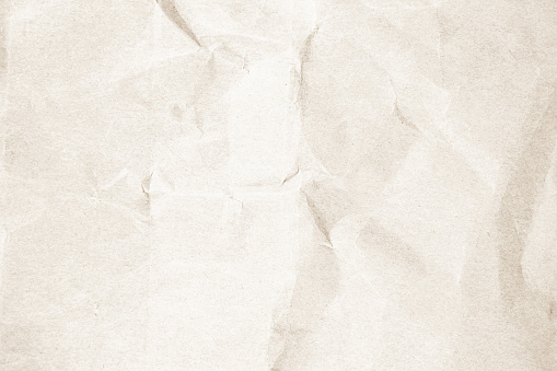 Brown recycled kraft paper crumpled vintage texture background for letter. Abstract parchment old retro page grunge blank newspaper. Cream pattern rough crease grunge surface backdrop with copy space.