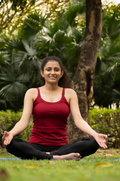 istock Young fit woman doing exercise in park 1475336422