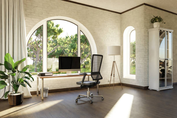istock comfortable workplace with pc workstation standing in front of large arched windows; landscape view; bright sunlight shines through window; remote work freelance concept; 3D Illustration 1475336776