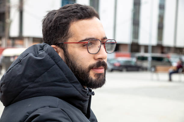 istock Young man in the street using eyeglasses 1475338265