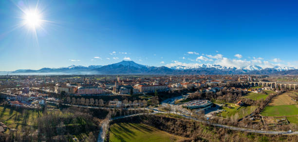 panorama drone view of Cuneo in the Itlaian Piedmont with snow-capped mountains behind Cuneo, Italy - 10 March, 2023: panorama drone view of Cuneo in the Itlaian Piedmont with snow-capped mountains behind cuneo stock pictures, royalty-free photos & images