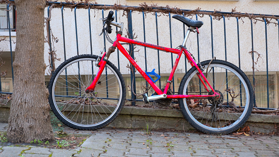 Red bicycle on the roadside