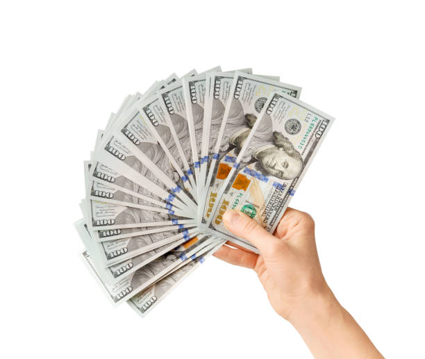 istock Dollars in hands on ? white background top view. 1475344680