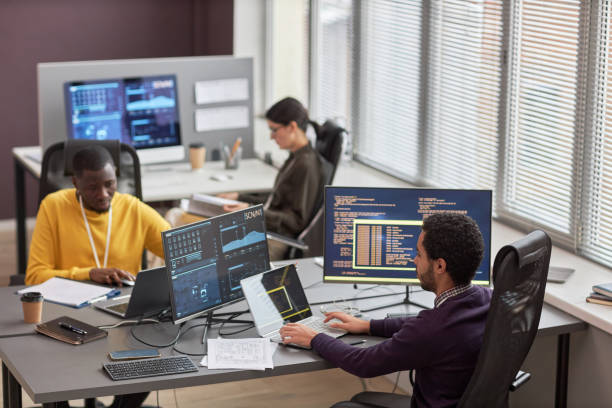 istock Group of people working with computers in IT development company 1475344787
