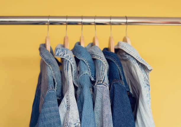 istock Jeans jackets and retro shirts on second hand market / flea market 1475347367