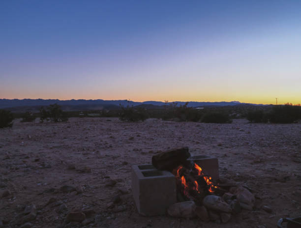 istock Peaceful in solitude  during sunset with bonfire in Joshua Tree, California 1475352459