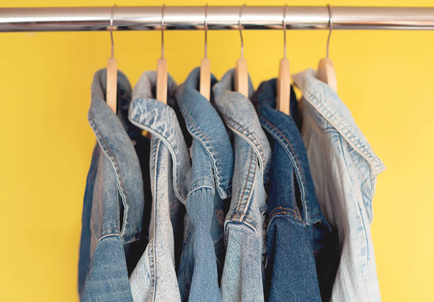 istock Jeans jackets and retro shirts on second hand market / flea market 1475352872