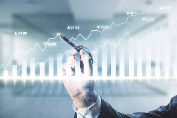 istock Multi exposure of analyst hand with pen working with virtual abstract financial diagram on blurred office background, banking and accounting concept 1475354908