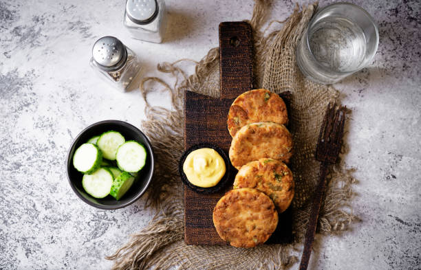 istock Salmon potato cakes with suace 1475355880