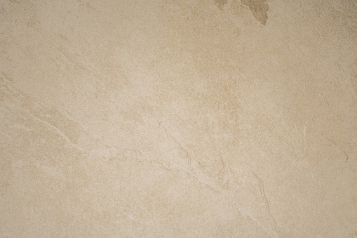 Smooth neutral pastel-colored beige Limestone Wall Texture gradient background