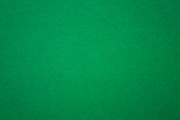 istock Bright Vibrant Green Homogenous Paper Background with smooth color gradient 1475359587
