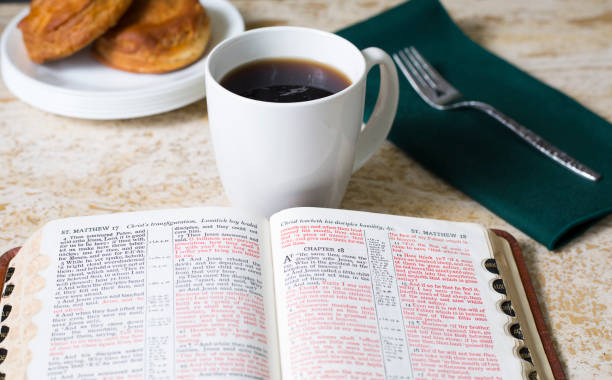 istock Friends share coffee and a snack as they study the Bible together. 1475362371