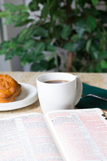 istock Friends share coffee and a snack as they study the Bible together. 1475362376