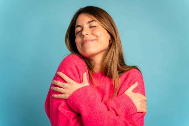 istock Smiling woman with closed eyes 1475362481