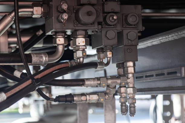 istock High pressure hydraulic hose system connected with steel pipes and connected to the system, close-up. Hydraulics of a large truck crane. 1475365884