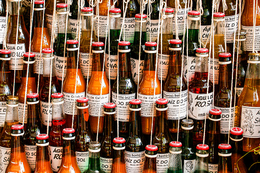 Bottles with traditional medicine, use for cold, back pain, rheumatism and other diseases at Ver-o-peso market - Belem - PA - Brazil