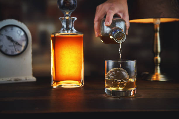 istock Pouring Whiskey On The Rocks 1475368092