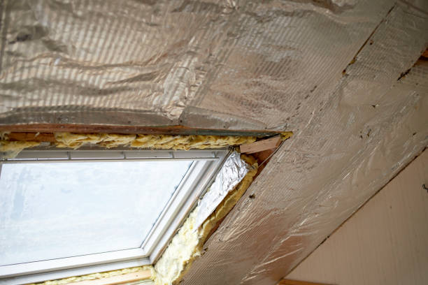 istock exposed old roof insulation in a house and a window 1475369240