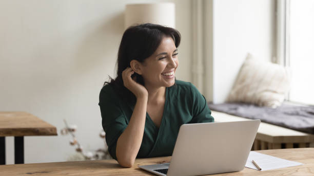 istock Happy freelance worker lady working at laptop in home office 1475369657