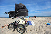 Baby carriage on a sandy beach
