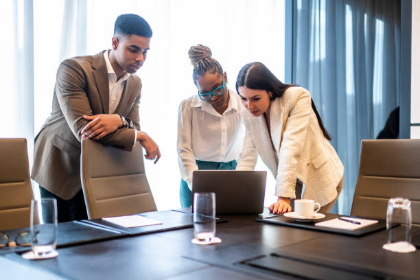 istock Three young entrepreneurs seen in a meeting room during working hours 1475370824