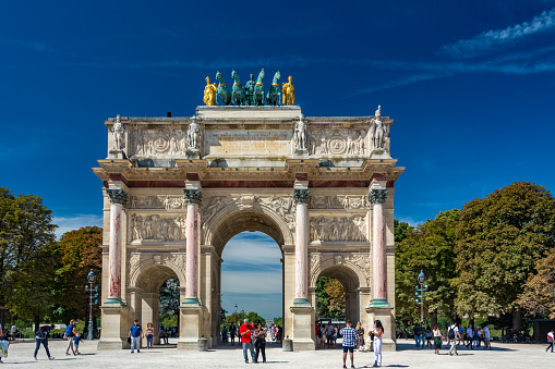 Paris, France - August 30, 2019 : The Arc de Triomphe du Carrousel at Tuileries Gardens with the Quadrga, a replica sculpted by Baron Francois Joseph Bosio (1768-1845)