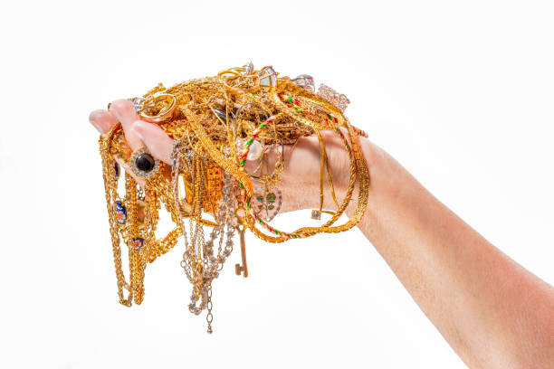 istock Womans Hand Holding Jewelry Isolated On White With Copy Space 1475377824