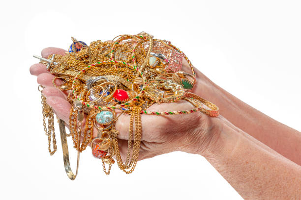 istock Two Hands Holding Jewelry On White With Copy Space 1475377828