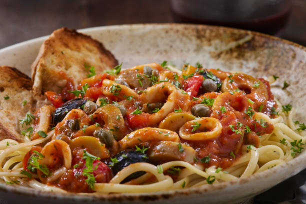 istock Saucy Italian Style Calamari with Tomatoes 1475379074