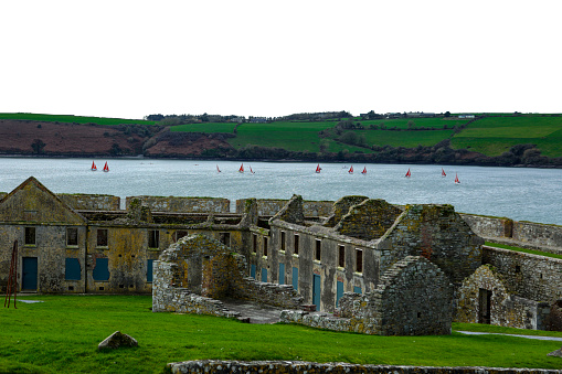 Historical ruined stone houses, historical place located in charles kinsale, Sailing training on the sea is given, people trying to learn to sail, Sailing Race, Too many sailboats at the sea, Sailing school, Shot of sailboats