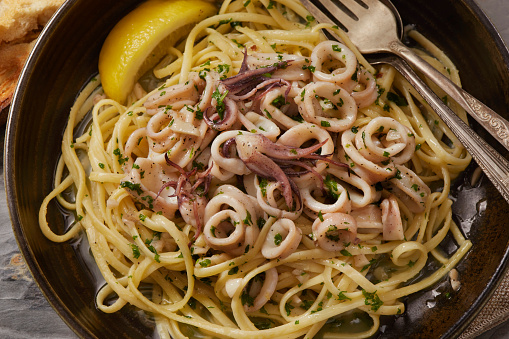 Lemon Pepper Grilled Calamari with Linguine, Garlic, Butter, Fresh Parsley and Toasted Bread